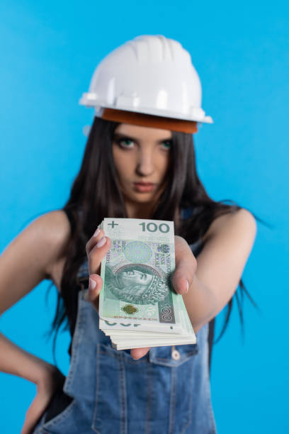 istock A young construction manager distributes banknotes to everyone who starts working together. 1222263682