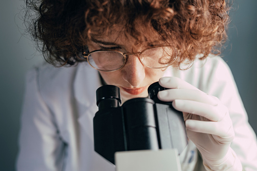 Science, research and sample with a doctor woman at work in a biological lab for innovation or development. Healthcare, medicine and study with a female scientist working on plants in a laboratory