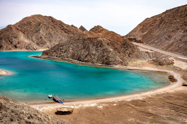 Beautiful view of the Fjord Bay - Taba, Egypt Beautiful Panoramic view of the Fjord Bay Taba in Aqaba Gulf, Egypt. Turquoise clear water of Red Sea and rocky mountains around. taba stock pictures, royalty-free photos & images