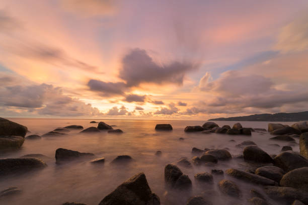 istock landscape long exposure Sunset beach and sea rock 1222268483