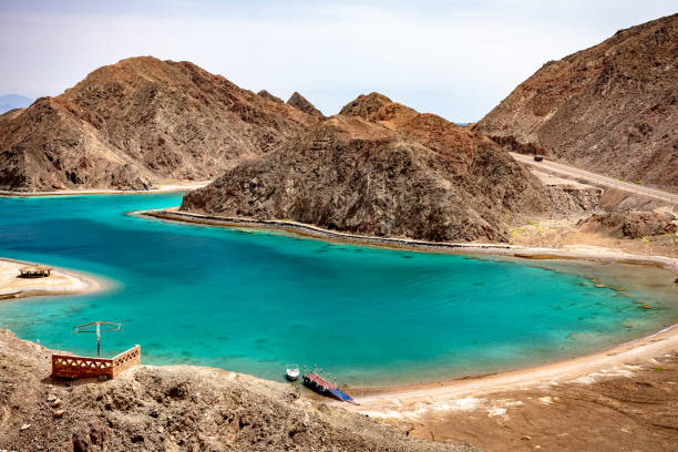 Panoramic view of the Fjord Bay - Taba, Egypt Beautiful Panoramic view of the Fjord Bay Taba in Aqaba Gulf, Egypt. Turquoise clear water of Red Sea and rocky mountains around. taba stock pictures, royalty-free photos & images