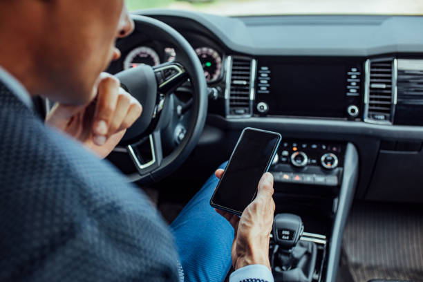 istock Unrecognizable Businessman Using a Smartphone in the Car 1222270621