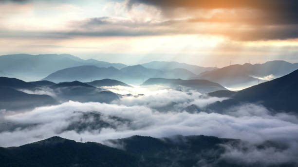 istock foggy and cloudy mountain landscape 1222273463