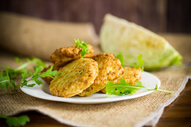 vegetable vegetarian fried cabbage pancakes in a plate stock photo