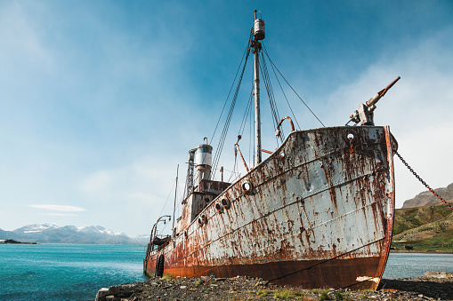 sunken ship, grounded transport ship, rusty skeleton of ship