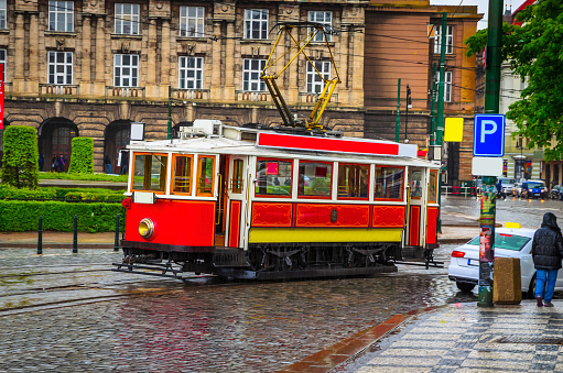 Vintage tram in old street of Prague, Czech Republic.
