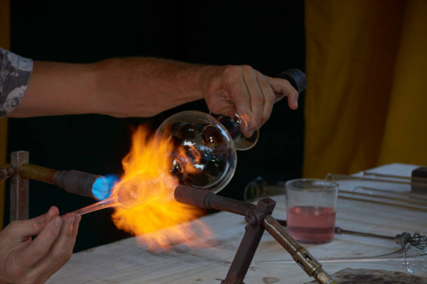 istock Skilful hands shaping hot and dangerous glass 1222274840
