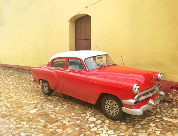 istock old red classical car in cuba 1222275987
