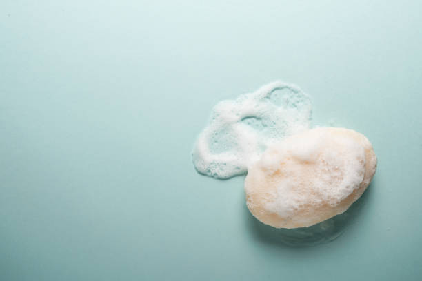 istock Soap and foam on a light background with place for text. 1222277922