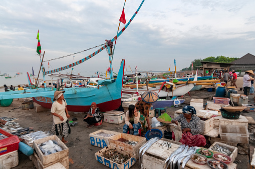 Jimbaran Beach, Bali, Indonesia - April 22, 2008: Overview of beach side fish market in late afternoon