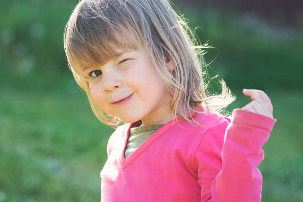 istock winking little girl 1222284695