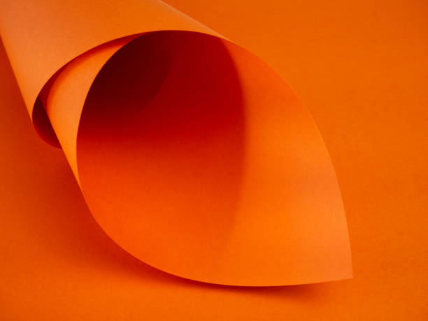 istock Abstract bright orange paper background for your design. Three-dimensional geometric image. Selected sharpness. 1222285551