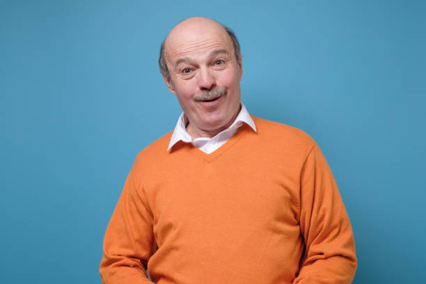 istock Senior hispanic bald man over blue background 1222285940