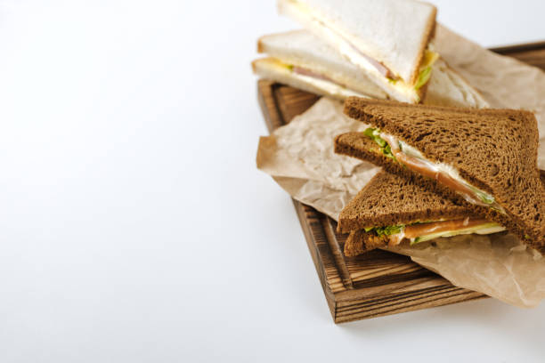 istock Dark and white bread sandwiches on a wooden board. 1222289652