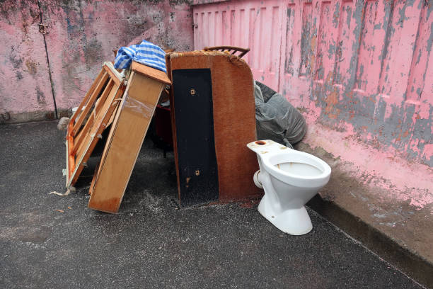 discarded furniture and white toilet stock photo