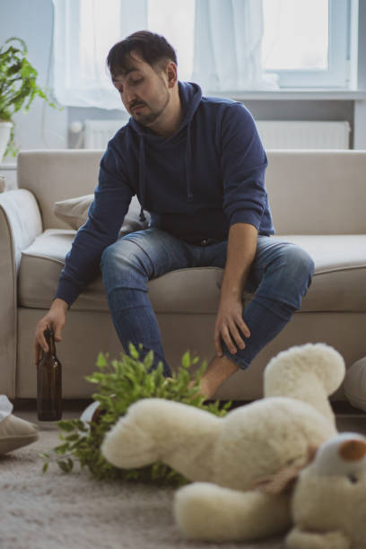 istock Handsome depressed man drinking alcohol at home. 1222292236