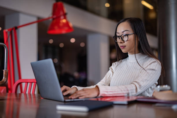 istock Young female typing something on laptop. 1222292650