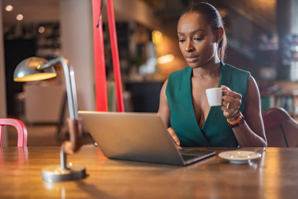 istock Serious businesswoman drinking coffee in her office. 1222293654