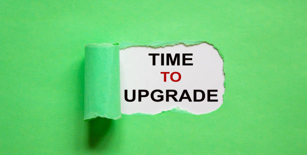 istock The text 'time to upgrade' appearing behind torn green paper. 1222296735