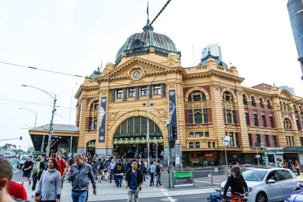 Melbourne, Australia-November 11, 2015: Flinders street station is Melbourne's main rail hub and train station. Public Transport serves metropolitan areas of Melbourne, Australia. The system combines buses, light rail, and trains and unites the urban and suburban regions of greater Melbourne. The system combines paid and free fare transit options. Image shot around downtown Melbourne during November 11, 2015.