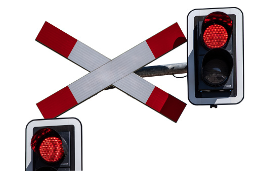 Road signs at the railway crossing with traffic light, isolated on white background. Railroad warning with flashing red light