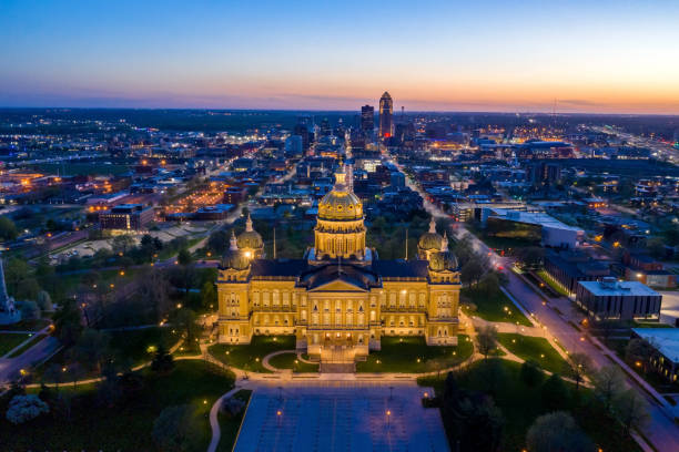 Over the Iowa State Capitol Building Aerial view of the Des Moines skyline behind the Iowa State Capitol building at sunset. iowa photos stock pictures, royalty-free photos & images