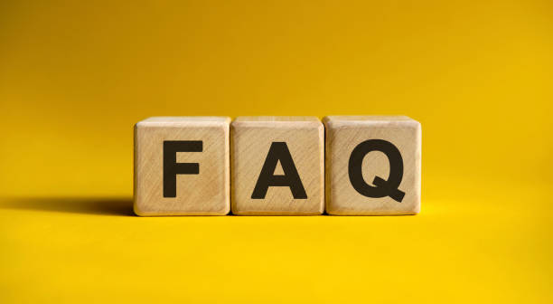 istock FAQ - text on wooden cubes, on yellow background 1222301932
