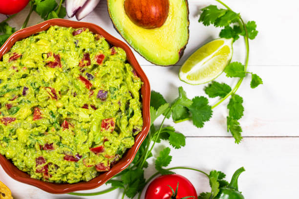 istock Guacamole Dip with Avocado, Lime, Tomato and Cilantro 1222303384