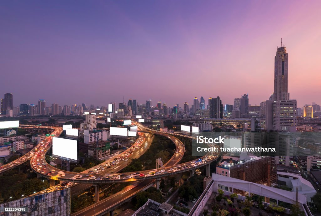 Bangkok cityscape Bangkok cityscape with blank billboard at twilight time Billboard Stock Photo