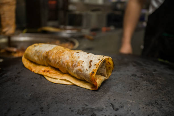 istock meat wrap doner kebap on black background - hatay usulu doner 1222305409