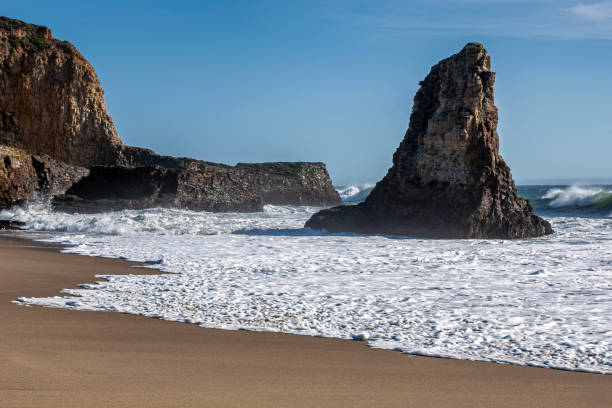 istock Ocean Waves Crashing on Rocky California Coast Beach 1222311647