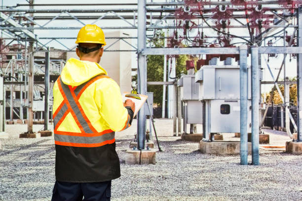 istock Young male manual worker wearing reflective clothing and holding document 1222311748