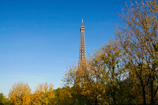 Paris, France - October 12, 2012. Tourist buses at the eiffel tower on October 12, 2012 in Paris, France. The eiffel tower gets millions of visitors every year.