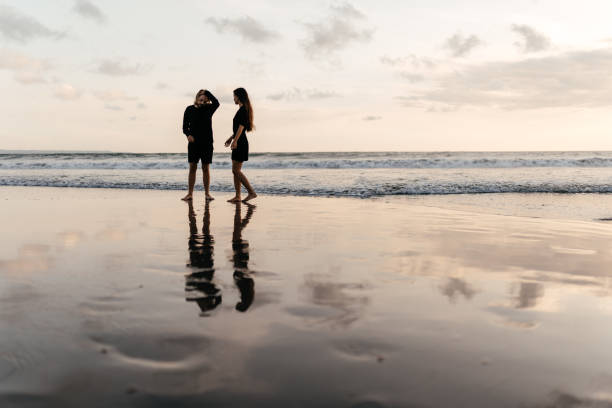 istock Attractive man and woman enjoying romantic evening on sunset 1222321143