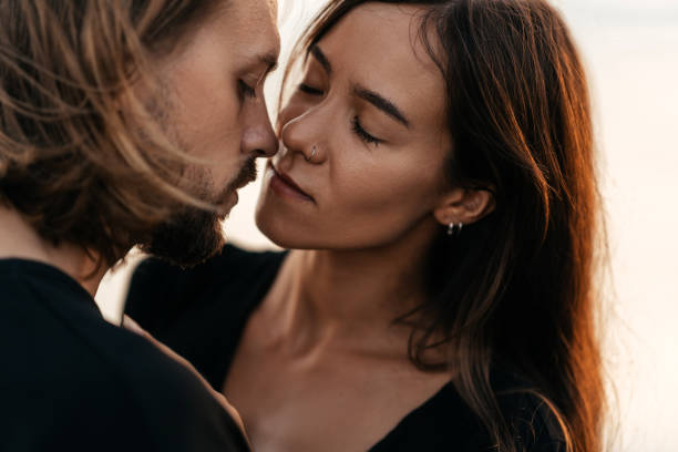 istock Attractive man and woman enjoying romantic evening on sunset 1222321148