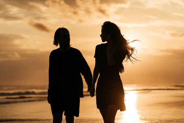 istock Attractive man and woman enjoying romantic evening on sunset 1222321165