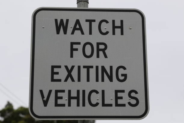 istock Watch out for exiting vehicles Sign 1222334261