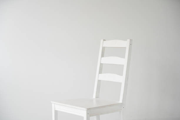 istock white room with white wooden chairs 1222334904