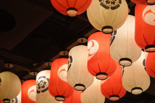 istock traditional Japanese red and white lanterns hanging on dark ceiling 1222334954