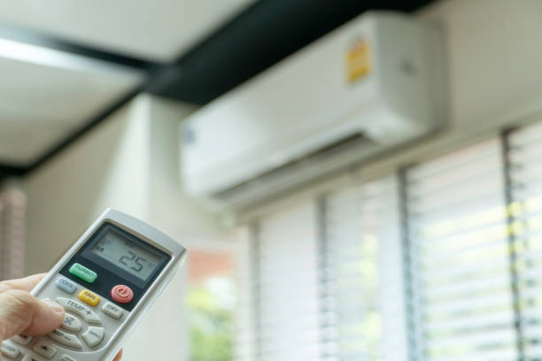 istock Air conditioning And remote control, Remote that points to the air conditioner Going to adjust the temperature Or test the device 1222335752