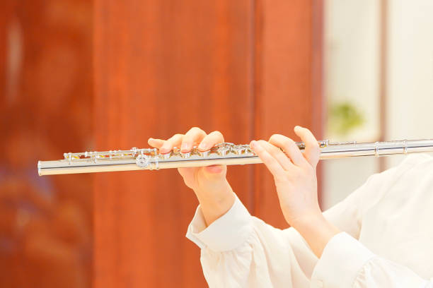 istock playing the flute in the room 1222336741