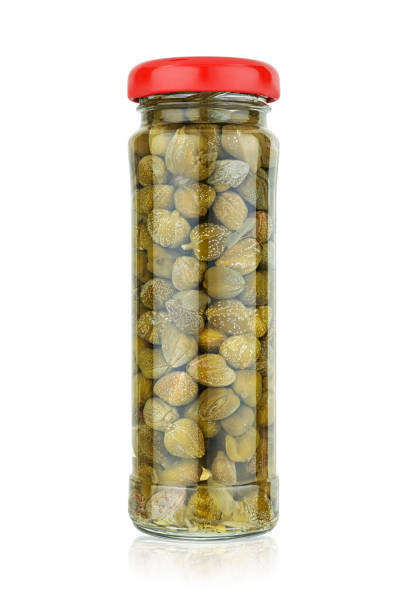 istock Glass jar with pickled capers isolated on white 1222336905