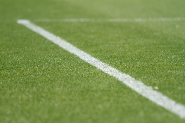 istock artificial grass and white line of stadium 1222338935