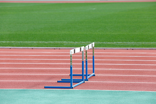 Close-up photo of a hurdle in an empty athletic stadium
