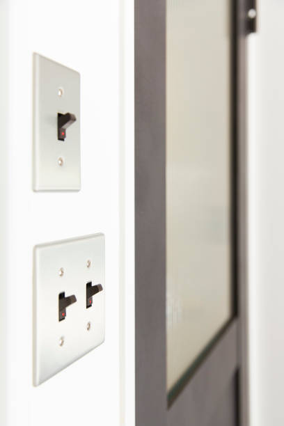 istock Lighting switch installed beside the room door 1222340452