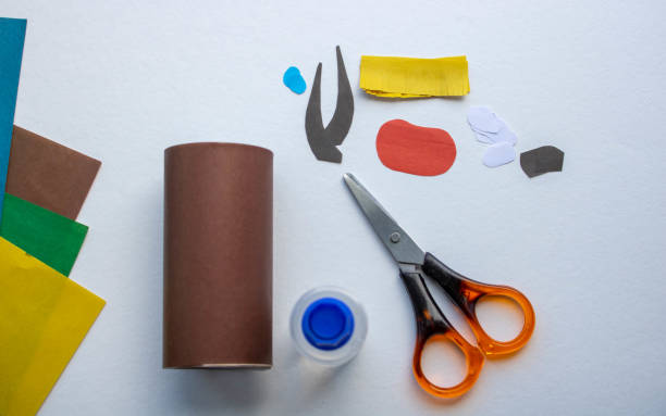 istock Step-by-step instructions. Step 3 Create a paper craft from a toilet sleeve. Brown bull. 2021.Chinese new year of the White Bull. Funny Halloween cute monster diy colored paper scissors glue. Children's educational education is an idea for creativity 1222340612
