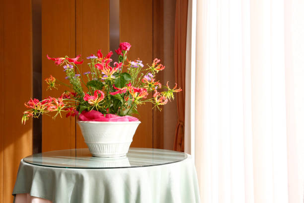 Flower vase on counter at a hotel interior.