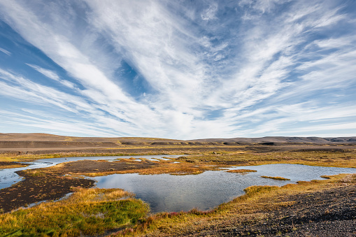 Icelandic Central Highlands Volcanic Landscape with natural ponds and small rivers in untouched nature under summer skyskape. Central Highlands, Iceland, Nordic Countries, Europe.