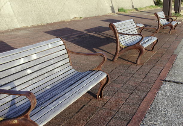 istock Image of the benches at the road along the beach. 1222341421