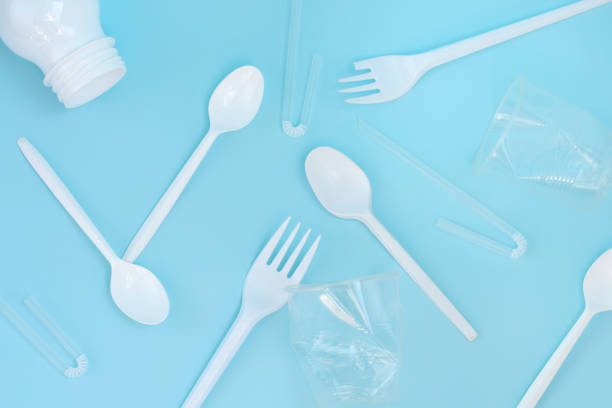 istock Plastic waste, plastic utensils on a blue background,flat lay. Say no to single use plastic. Ecology environmental care.Copy space for text. 1222343342